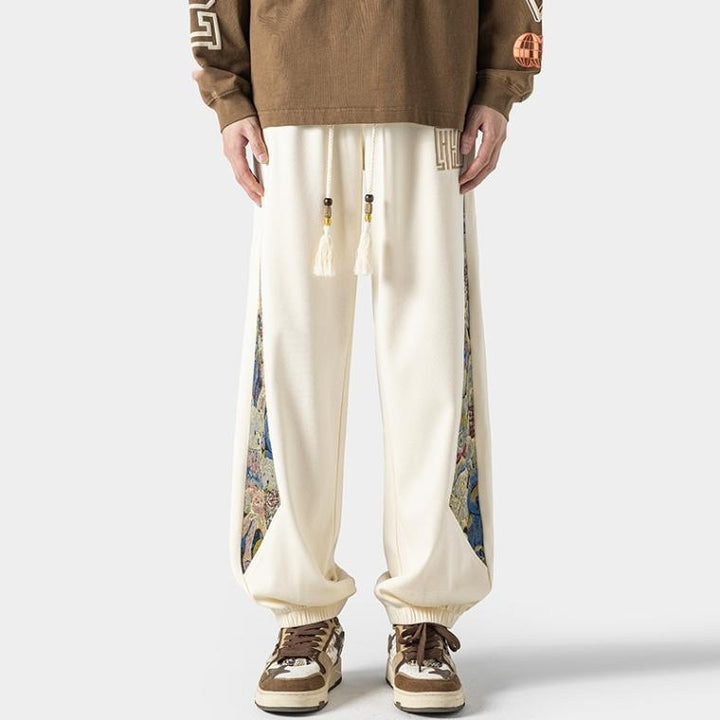 Pantalones casuales de tendencia nacional para hombre, primavera 2024: estilo urbano americano, pantalones deportivos holgados.