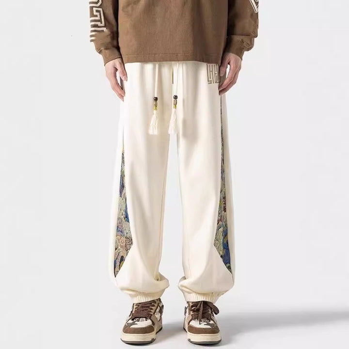 Pantalones casuales de tendencia nacional para hombre, primavera 2024: estilo urbano americano, pantalones deportivos holgados.