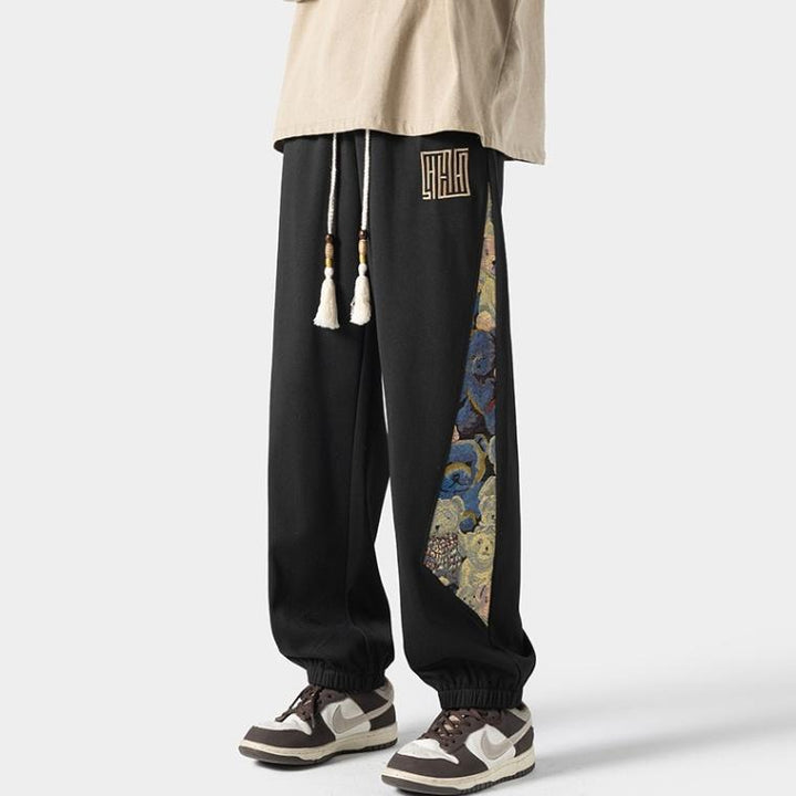 Pantalones casuales de tendencia nacional para hombre, primavera 2024: estilo urbano americano, pantalones deportivos holgados.