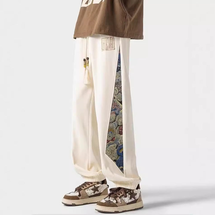 Pantalones casuales de tendencia nacional para hombre, primavera 2024: estilo urbano americano, pantalones deportivos holgados.