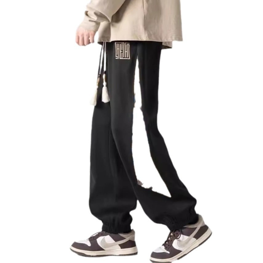 Pantalones casuales de tendencia nacional para hombre, primavera 2024: estilo urbano americano, pantalones deportivos holgados.