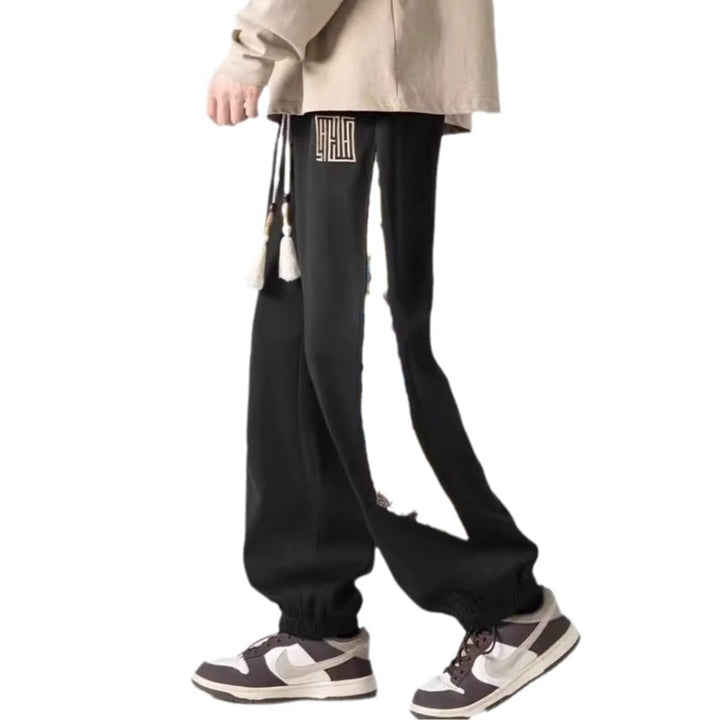 Pantalones casuales de tendencia nacional para hombre, primavera 2024: estilo urbano americano, pantalones deportivos holgados.
