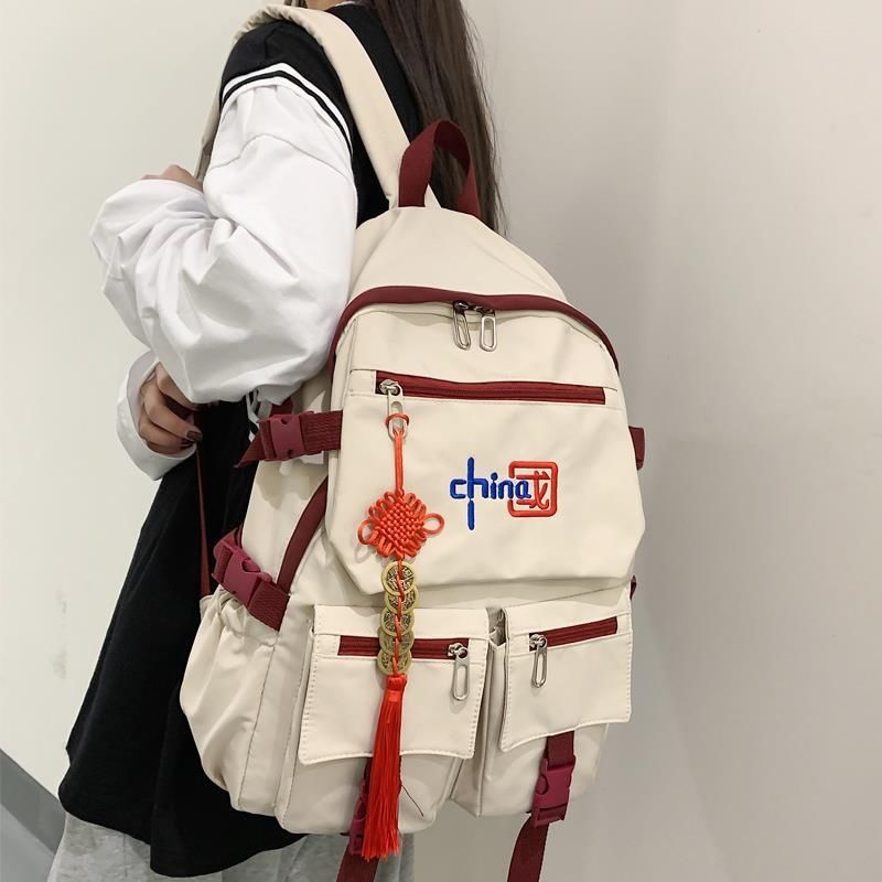 Mochila de estilo chino HD para niñas y niños, moderna y de gran capacidad para portátiles de estudiantes de secundaria y universitarios.